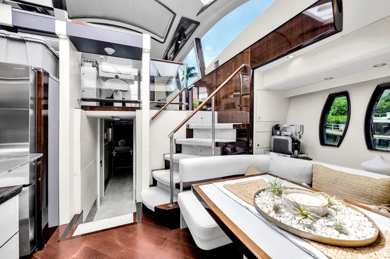 Slide: The Image of Innenraum einer luxuriösen Yacht mit eleganten Holzakzenten, Treppen und einem gemütlichen Sitzbereich. - 22