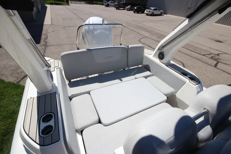 Slide: The Image of 2023 Zodiac Medline 7.5 boat interior with cushioned seating and cup holders. - 12