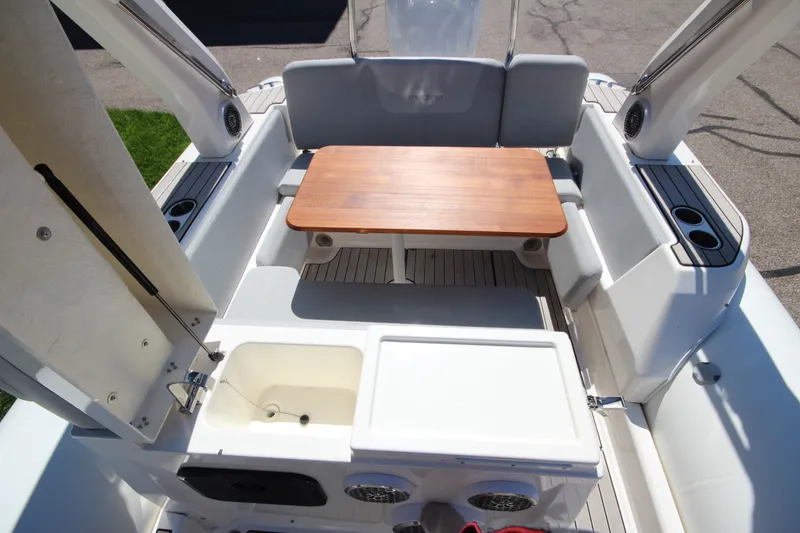 Slide: The Image of 2023 Zodiac Medline 7.5 boat interior with seating, table, and storage compartments. - 17