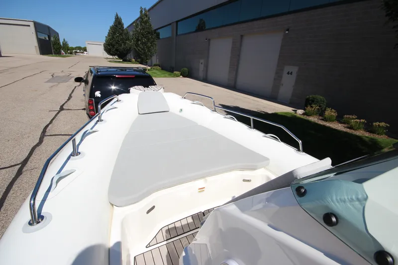 Slide: The Image of 2023 Zodiac Medline 7.5 boat on trailer, parked near industrial building. - 22