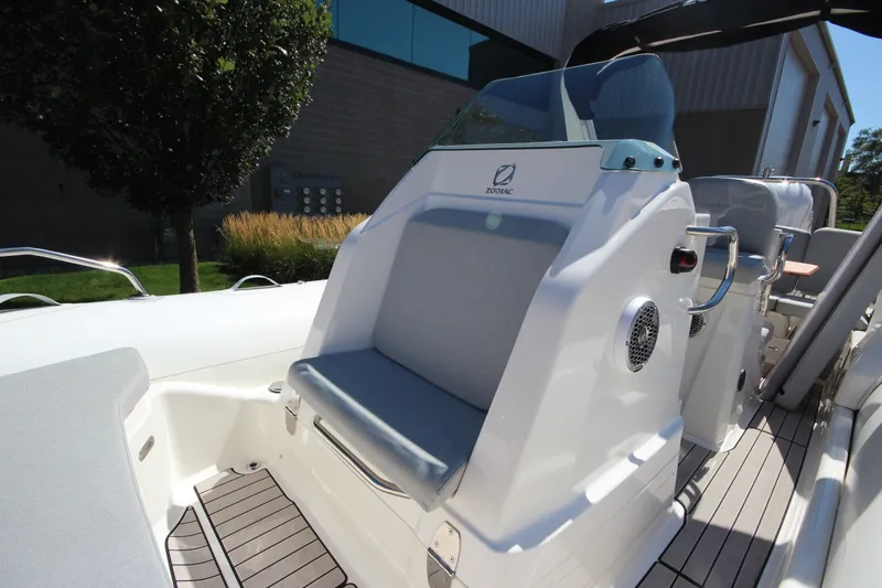 Slide: The Image of 2023 Zodiac Medline 7.5 boat interior with seating and control panel, showcasing modern design. - 26