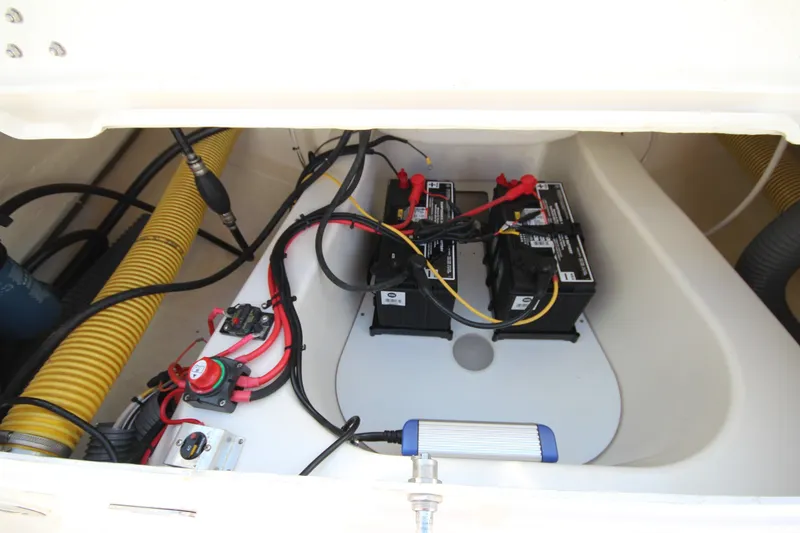 Slide: The Image of 2023 Zodiac Medline 7.5 boat battery compartment with wiring and components. - 15