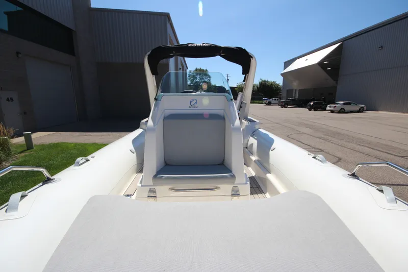 Slide: The Image of 2023 Zodiac Medline 7.5 boat, docked outdoors, showcasing seating and sleek design. - 25