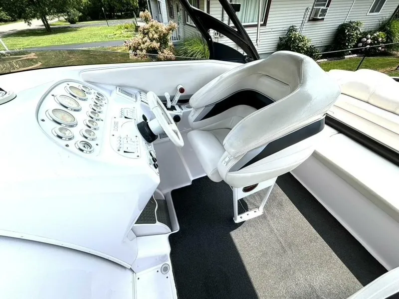 Slide: The Image of The image shows the cockpit of a 2005 Donzi 33 ZX with a white helm and cushioned seat. - 22