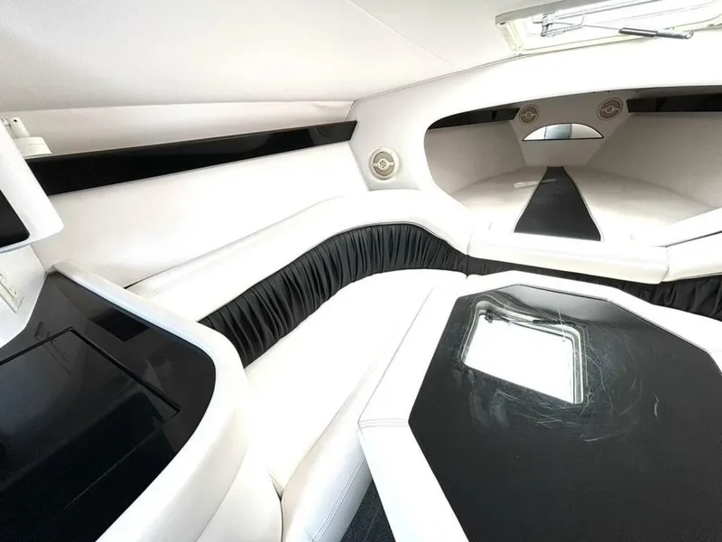 Slide: The Image of Interior of a 2005 Donzi 33 ZX with white upholstery and black accents. - 31