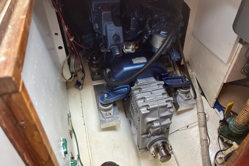 Slide: The Image of Engine compartment of a 1980 Cape Dory 30 sailboat, showcasing mechanical components. - 31