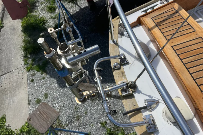 Slide: The Image of 1980 Cape Dory 30 sailboat deck with stainless steel fittings and wooden accents. - 7
