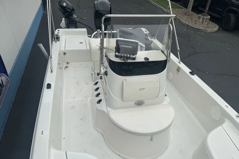 Slide: The Image of 2012 Ranger 220 Bahia boat interior with console and seating. - 19