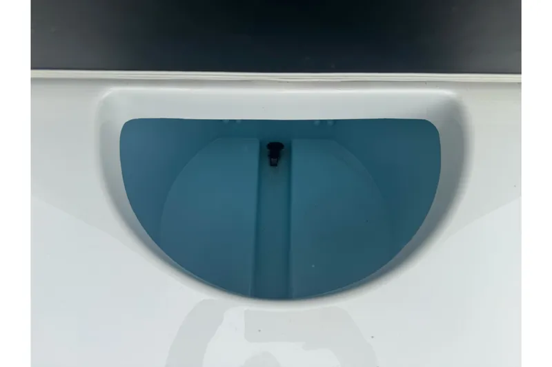 Slide: The Image of Livewell of a 2012 Ranger 220 Bahia boat, featuring a clean, blue interior. - 20
