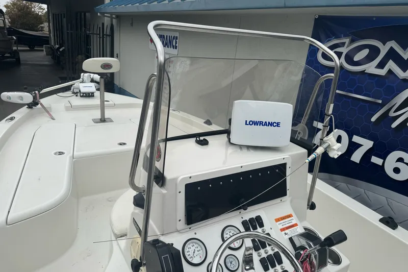 Slide: The Image of 2012 Ranger 220 Bahia boat dashboard with Lowrance electronics and steering wheel. - 17