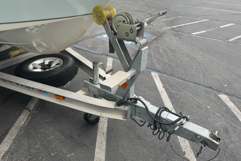 Slide: The Image of Trailer hitch and winch of a 2012 Ranger 220 Bahia boat in parking lot. - 3