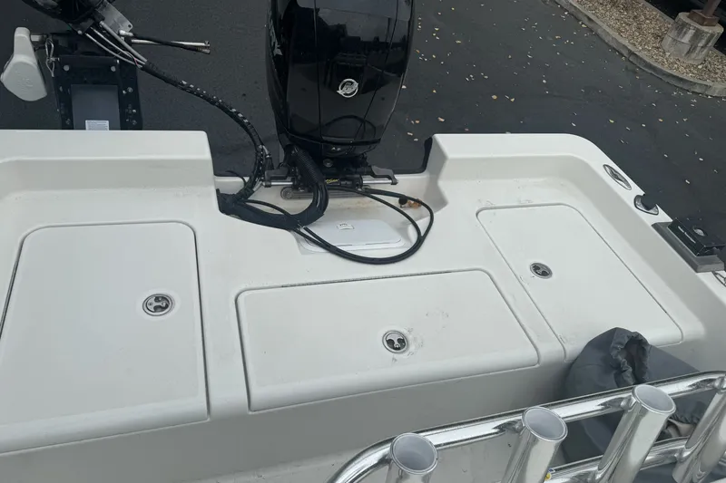 Slide: The Image of 2012 Ranger 220 Bahia boat deck with motor and storage compartments. - 11