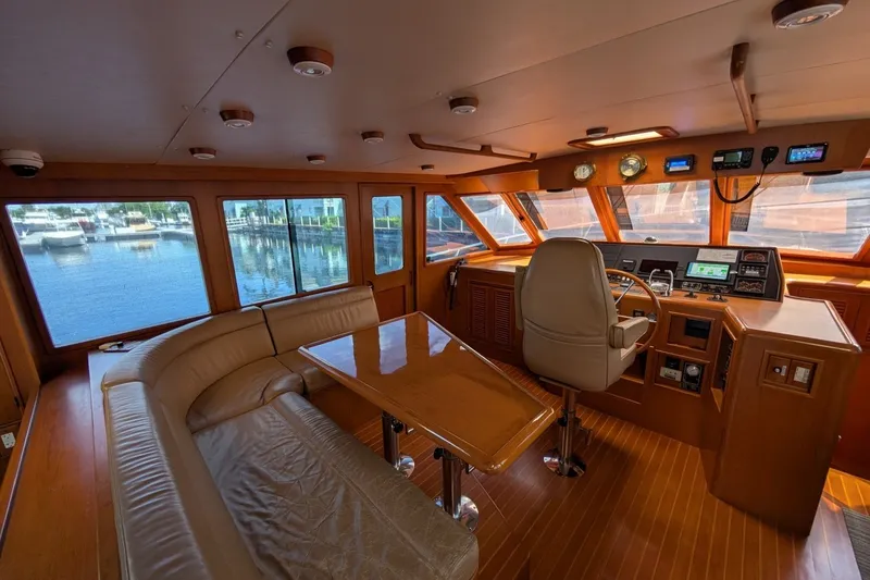 Slide: The Image of Luxurious 1997 Offshore Yachts Pilothouse Motoryacht interior with helm and seating area. - 17