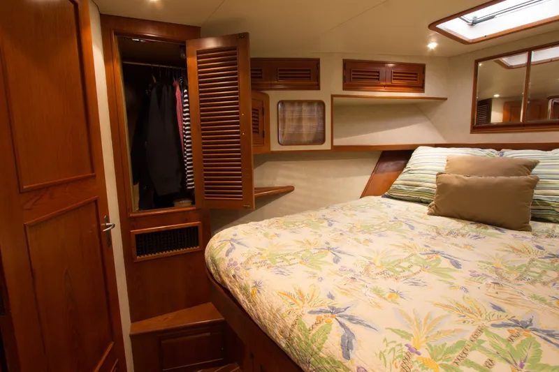 Slide: The Image of Luxurious cabin interior of a 1997 Offshore Yachts Pilothouse Motoryacht with cozy bedding. - 22