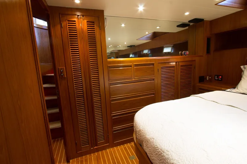 Slide: The Image of Luxurious wood-paneled bedroom interior of a 1997 Offshore Yachts Pilothouse Motoryacht. - 18