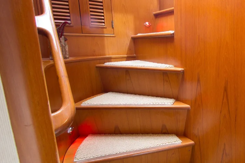 Slide: The Image of Wooden staircase inside 1997 Offshore Yachts Pilothouse Motoryacht, featuring carpeted steps. - 20