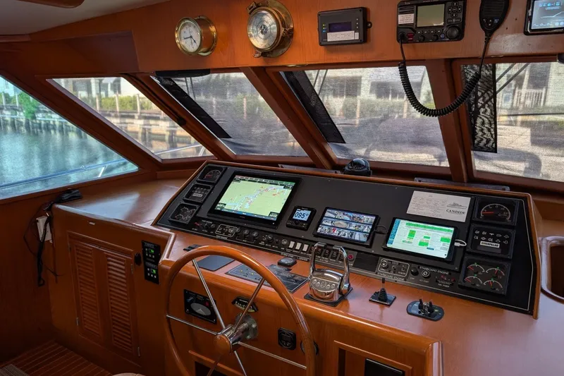 Slide: The Image of Interior view of 1997 Offshore Yachts Pilothouse Motoryacht helm with navigation equipment. - 15