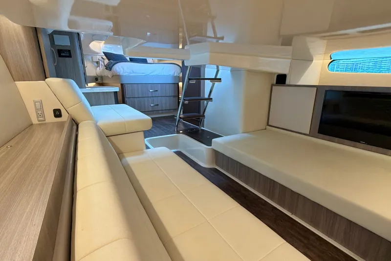 Slide: The Image of Luxurious interior of 2022 Regal 36 XO yacht with modern seating and sleeping area. - 41