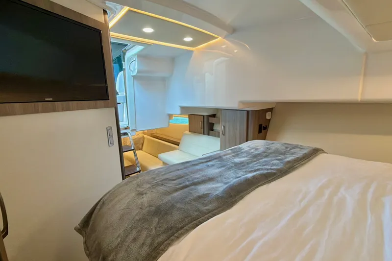 Slide: The Image of Interior of 2022 Regal 36 XO yacht with cozy bed and modern amenities. - 37