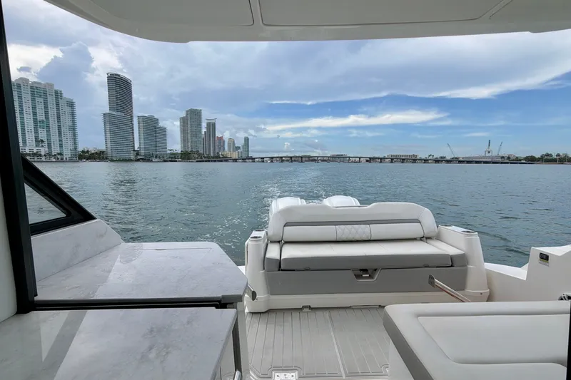 Slide: The Image of 2022 Regal 36 XO yacht interior with city skyline view. - 14