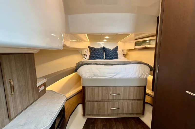 Slide: The Image of Luxurious cabin interior of 2022 Regal 36 XO yacht with cozy bedding. - 35