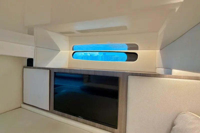 Slide: The Image of Interior of 2022 Regal 36 XO yacht with window and TV. - 42