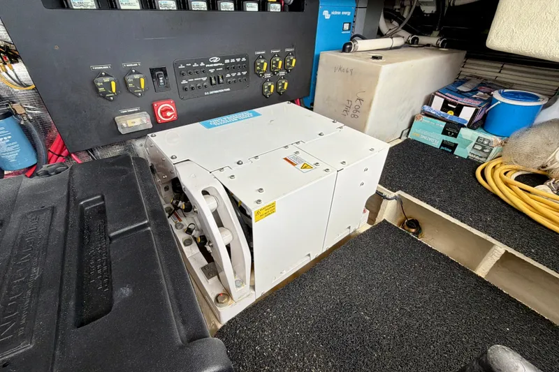 Slide: The Image of Electrical panel and equipment in a 2022 Regal 36 XO boat interior. - 47