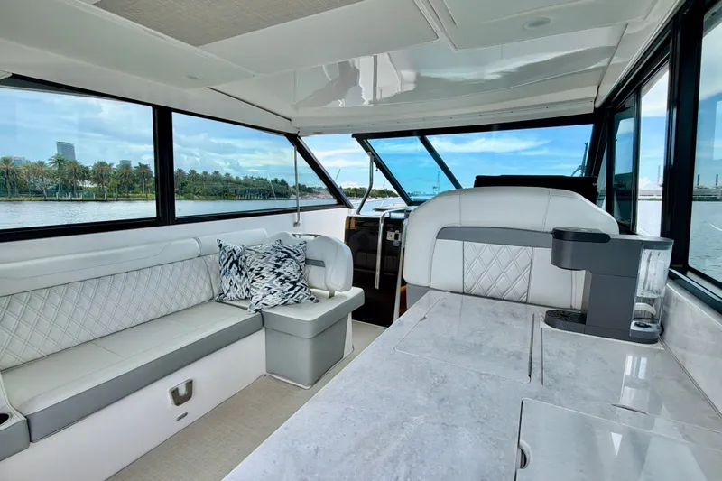 Slide: The Image of Luxurious interior of 2022 Regal 36 XO yacht with elegant seating and scenic views. - 19