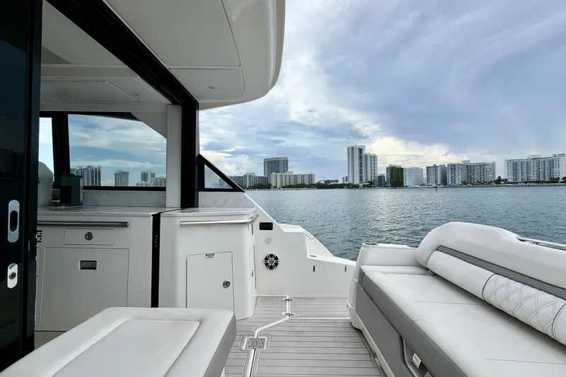 Slide: The Image of 2022 Regal 36 XO yacht interior with city skyline view. - 15