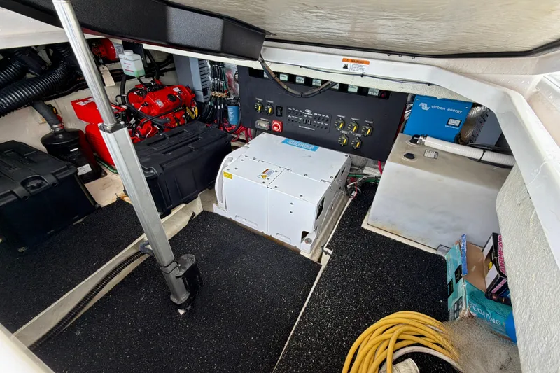 Slide: The Image of Engine room of 2022 Regal 36 XO boat with equipment and wiring. - 44