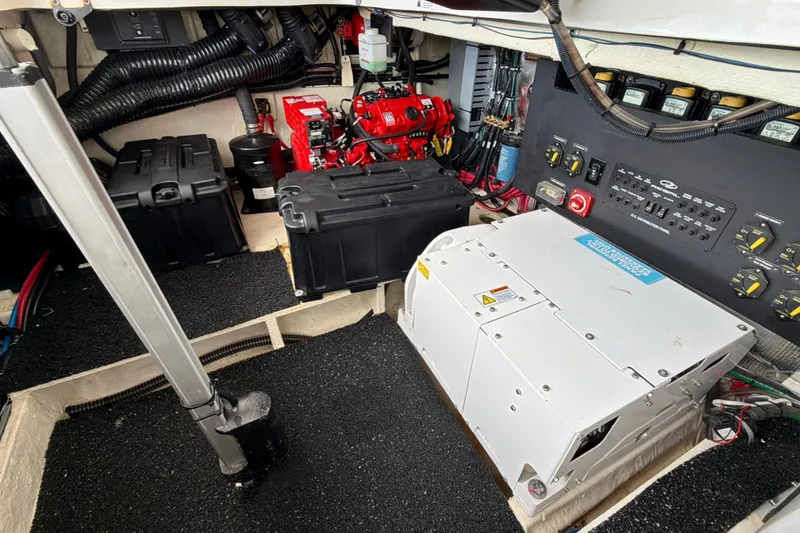 Slide: The Image of Engine room of 2022 Regal 36 XO boat with electrical components and wiring. - 45