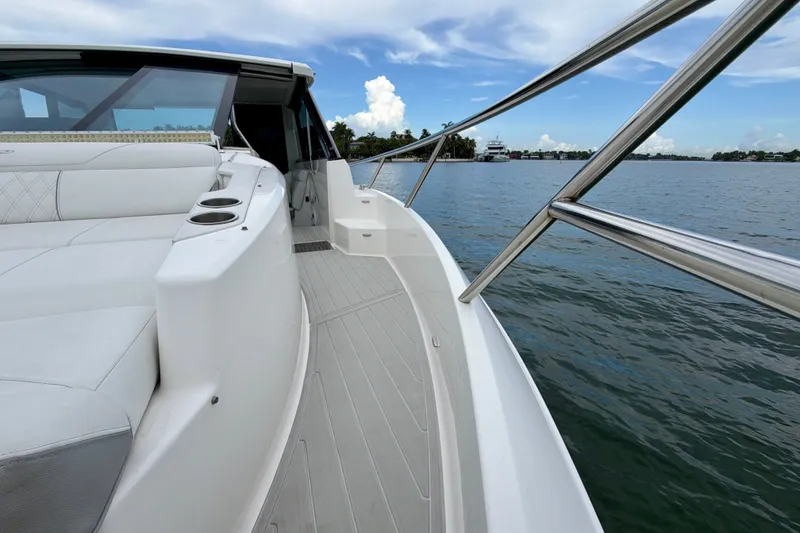 Slide: The Image of 2022 Regal 36 XO boat deck with luxurious seating and ocean view. - 32