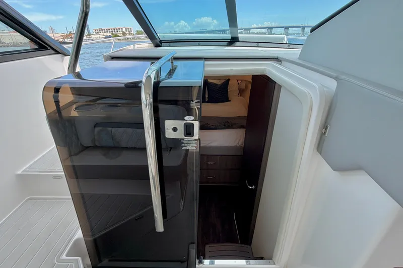 Slide: The Image of Interior view of 2022 Regal 36 XO yacht cabin entrance with sleek design. - 34