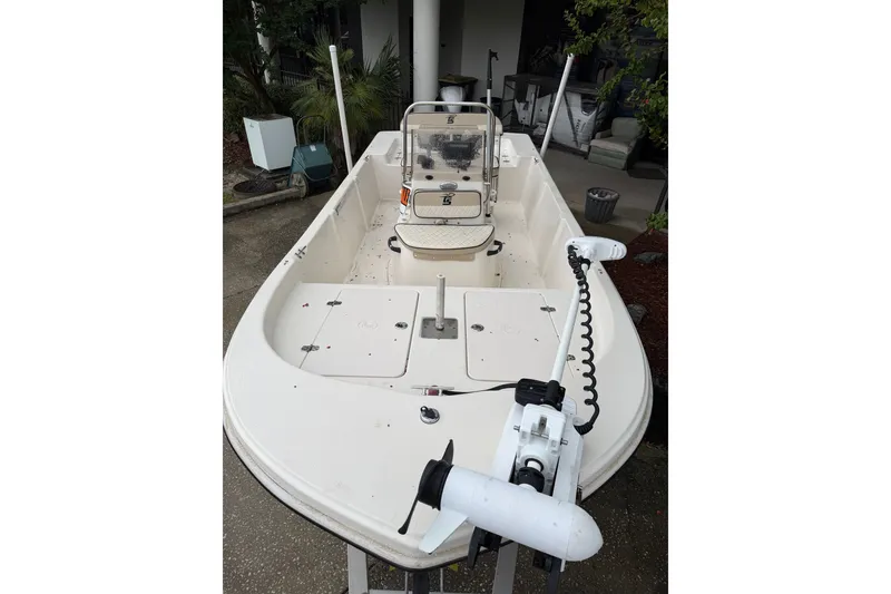 Slide: The Image of 2022 Carolina Skiff 178 CC boat with trolling motor, parked outdoors. - 6