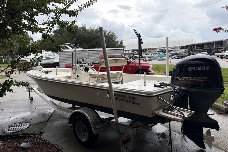 Slide: The Image of 2022 Carolina Skiff 178 CC boat on trailer with Yamaha outboard motor. - 2