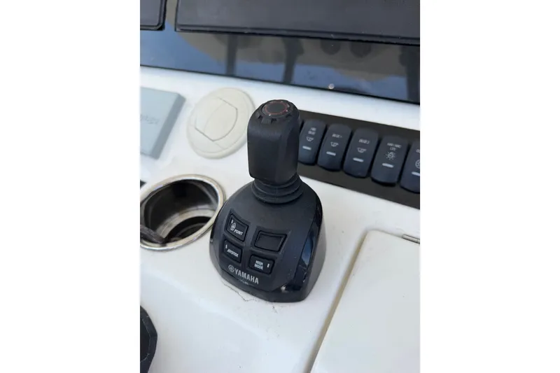 Slide: The Image of Yamaha joystick control on 2019 Regulator 41 boat dashboard. - 32