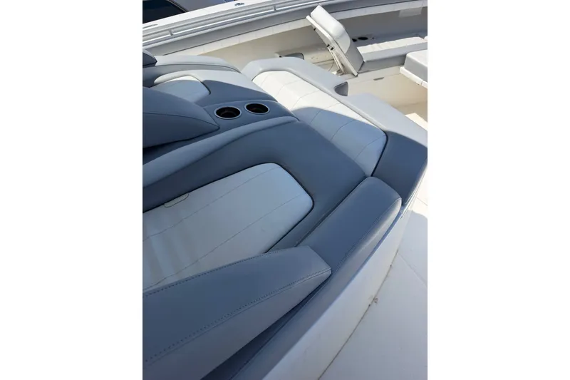 Slide: The Image of Luxurious seating on 2019 Regulator 41 boat with cup holders. - 43
