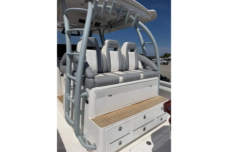 Slide: The Image of 2019 Regulator 41 boat seating area with cushioned seats and storage compartments. - 26