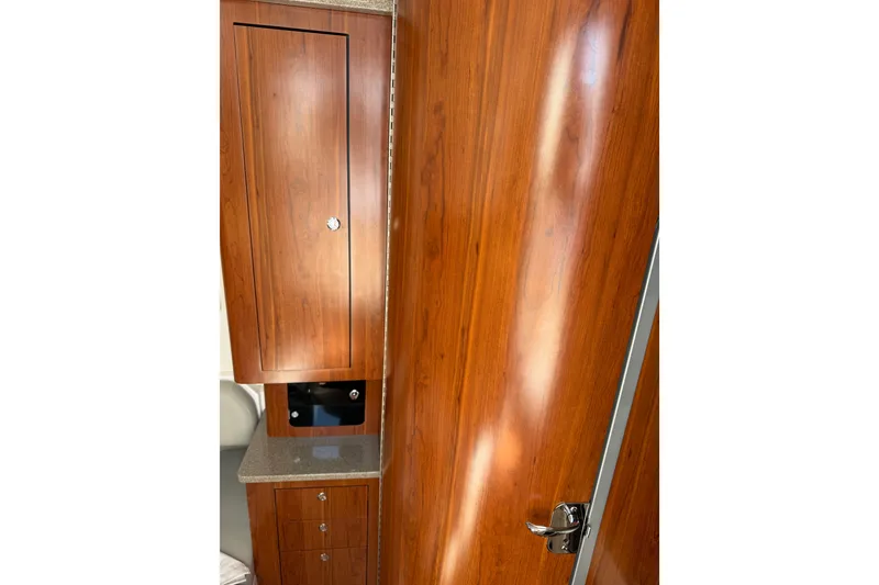 Slide: The Image of Interior of 2019 Regulator 41 boat with polished wood cabinetry and sleek design. - 50