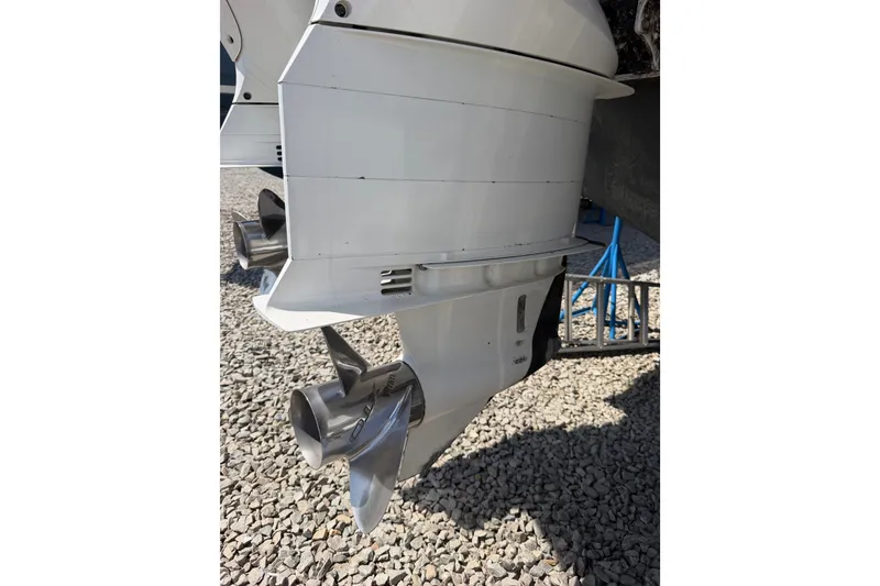 Slide: The Image of 2019 Regulator 41 boat propeller and outboard motor on gravel surface. - 22