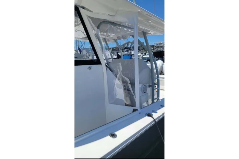 Slide: The Image of 2019 Regulator 41 boat, side view of helm station and seating area. - 36