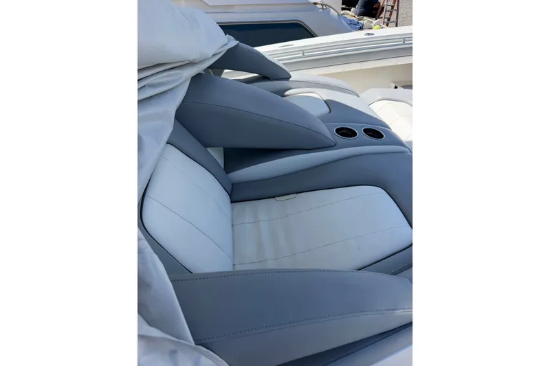 Slide: The Image of Luxurious seating on a 2019 Regulator 41 boat, featuring cup holders and sleek design. - 42