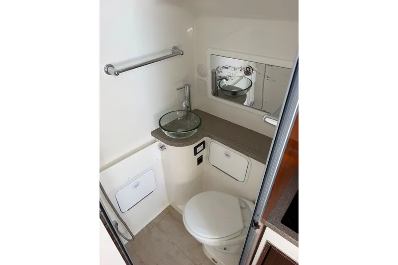 Slide: The Image of 2019 Regulator 41 boat bathroom with modern sink and toilet. - 52