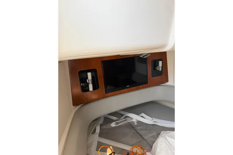 Slide: The Image of 2019 Regulator 41 cabin interior with wooden panel and built-in TV. - 48