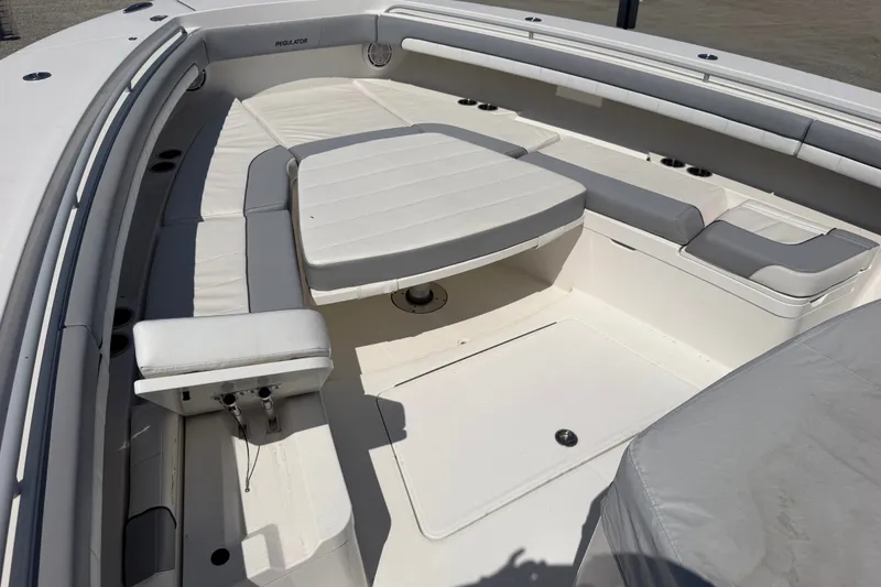 Slide: The Image of 2019 Regulator 41 boat interior with cushioned seating and table. - 40