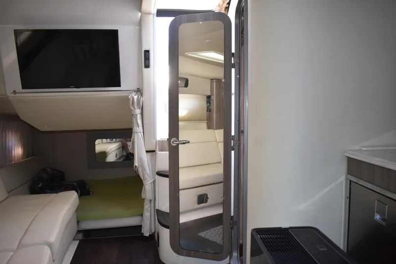 Slide: The Image of Interior of 2020 Regal 35 Sport Coupe with modern seating and TV. - 30