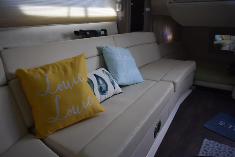 Slide: The Image of Luxurious interior of 2020 Regal 35 Sport Coupe with stylish cushions on a cream sofa. - 23