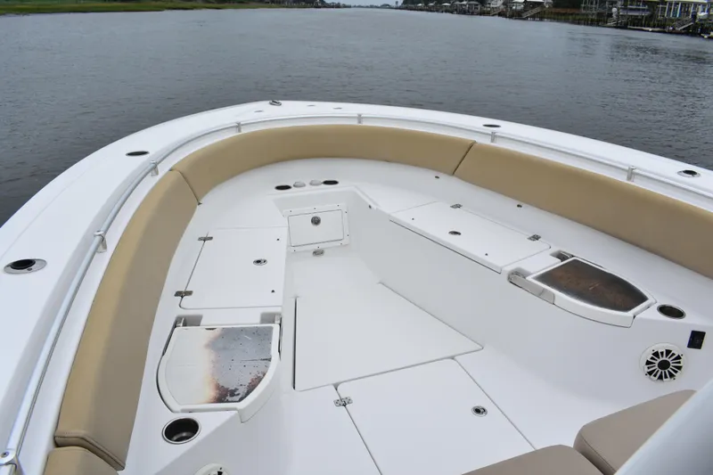 Slide: The Image of 2017 Sportsman Open 312 Center Console boat interior with spacious seating and storage. - 6