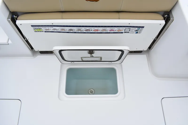 Slide: The Image of 2017 Sportsman Open 312 Center Console livewell with cushioned seating and storage. - 15