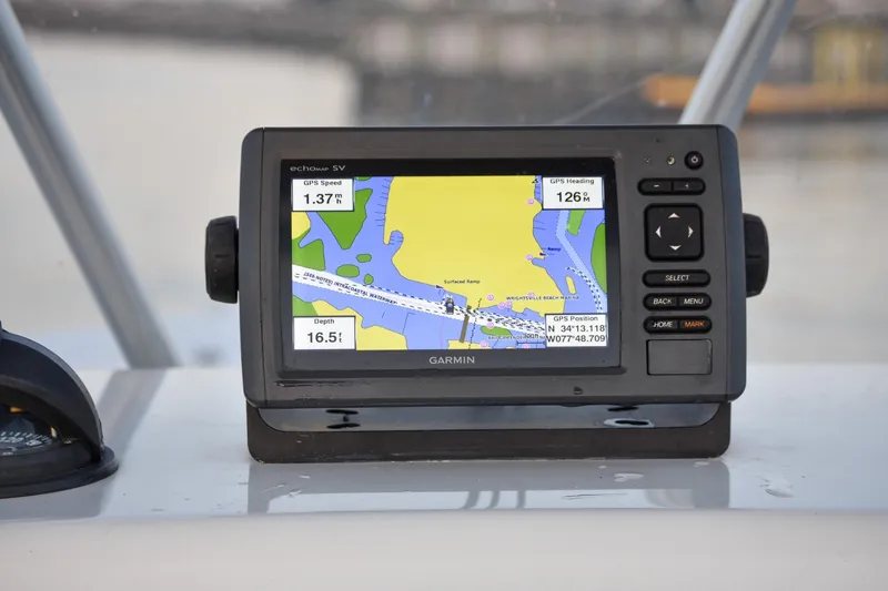 Slide: The Image of Garmin GPS device on 2007 Tidewater 216 CC Adventure boat dashboard. - 10